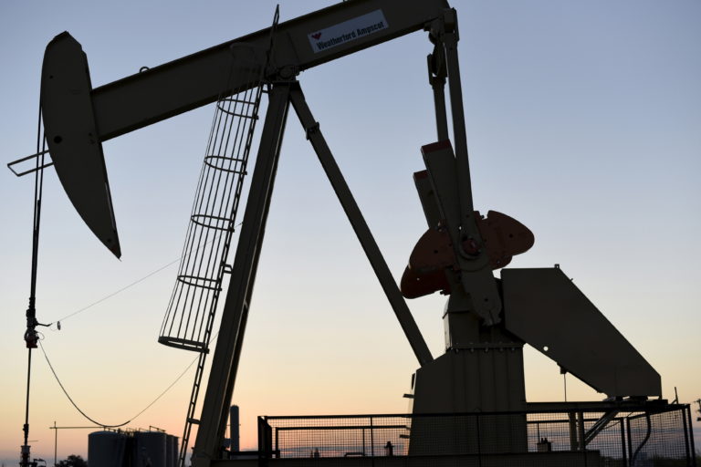 Oil pumpjack at sunset